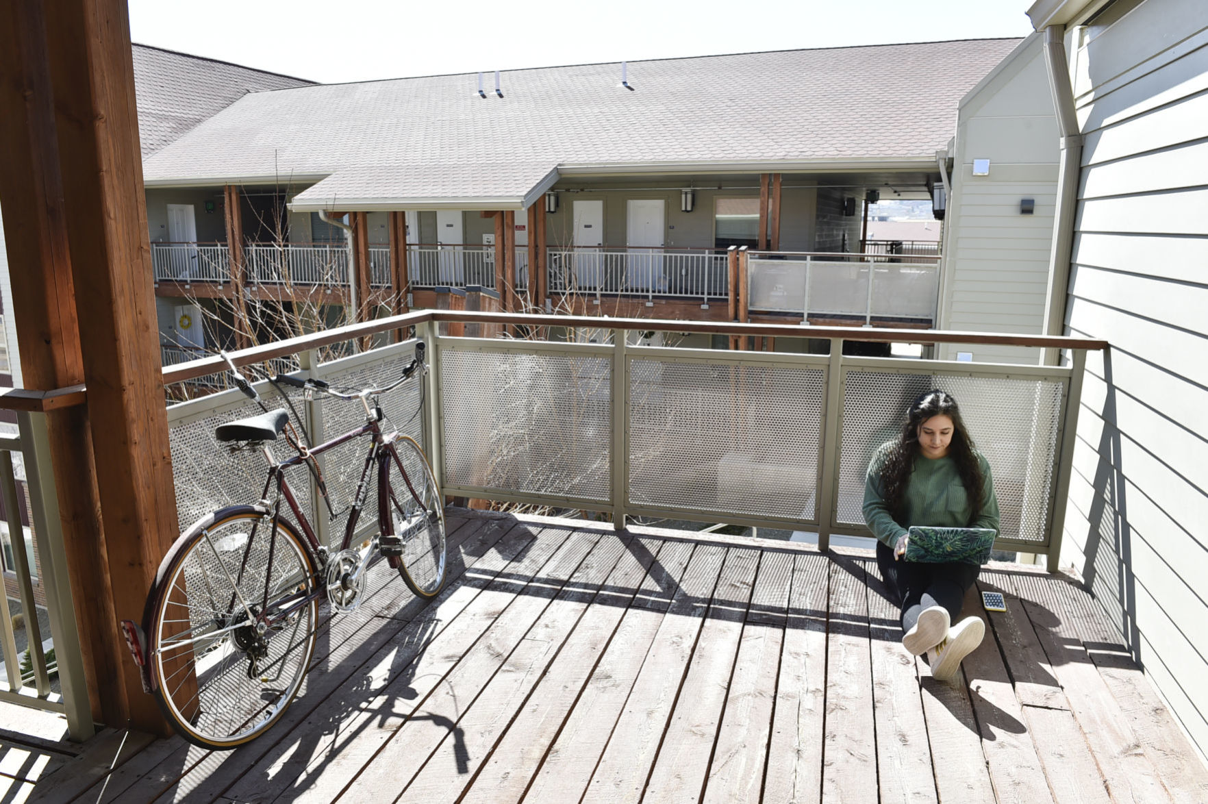 Carroll College senior Krysten Abboud joins a video conference from the deck of her campus apartment